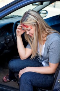 Woman in need of chiropractic care after an auto accident